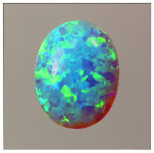 Lab Created Opal:  Oval Cabochon Light Blue (k-6) Lab Created Opal